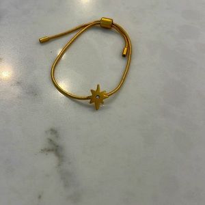 I am selling this gold necklace that has a star on it